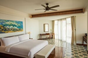 ceiling fan installed in bedroom with tile flooring