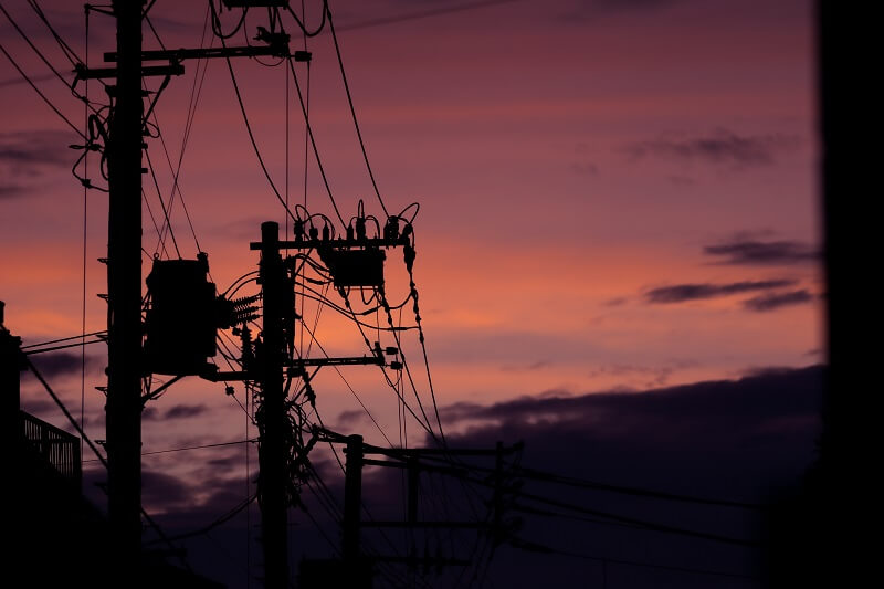 dark image of power poles during an outage